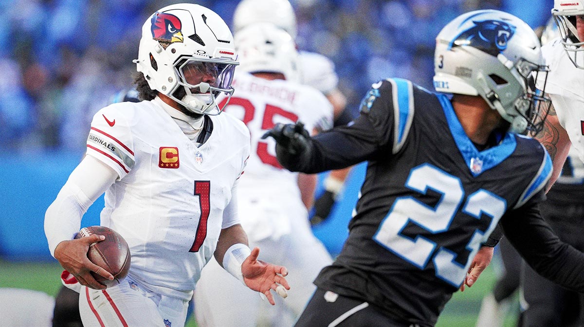 Arizona Cardinals quarterback Kyler Murray (1) runs to the end zone trying to elude Carolina Panthers cornerback Dane Jackson (23) during the second half at Bank of America Stadium.