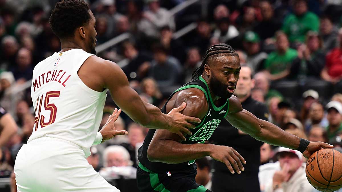 Boston Celtics Guard Jailen Brown (7) control the ball until Cleveland Cavaliers Keeper Danovan Mitchell (45) defends during the first half in the TD garden.