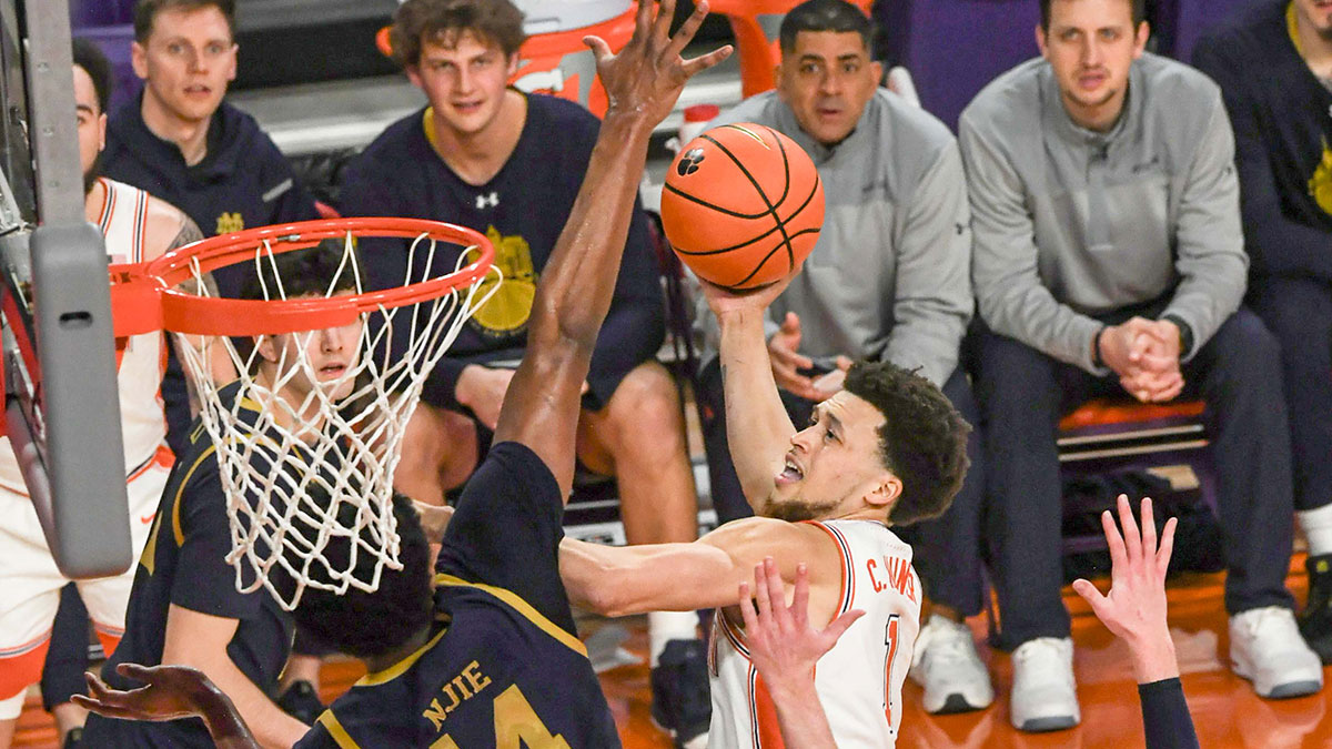 Clemson guard Chase Hunter (1) scores near Notre Dame forward Kebba Njie (14) during the first half at Littlejohn Coliseum.