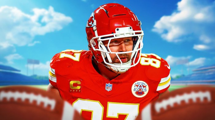 Travis Kelce with his head down.