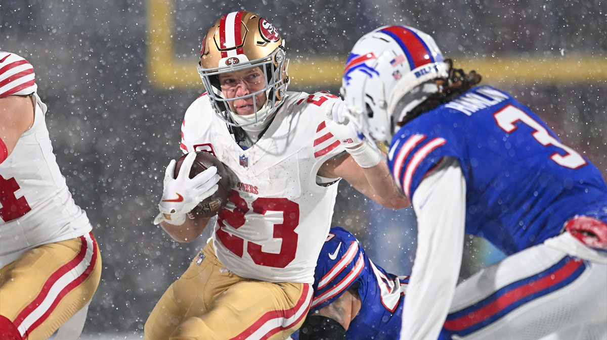 San Francisco 49ers running back Christian McCaffrey (23) tries to avoid Buffalo Bills safety Damar Hamlin (3) on a run in the first quarter at Highmark Stadium.