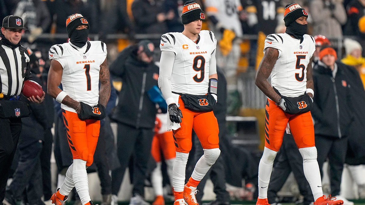 Cincinnati Bengals wide receiver Ja'Marr Chase (1), quarterback Joe Burrow (9) and wide receiver Tee Higgins (5) take the field as captains for the coin toss before the first quarter of the NFL Week 18 game between the Pittsburgh Steelers and the Cincinnati Bengals at Acrisure Stadium in Pittsburgh on Saturday, Jan. 4, 2025.