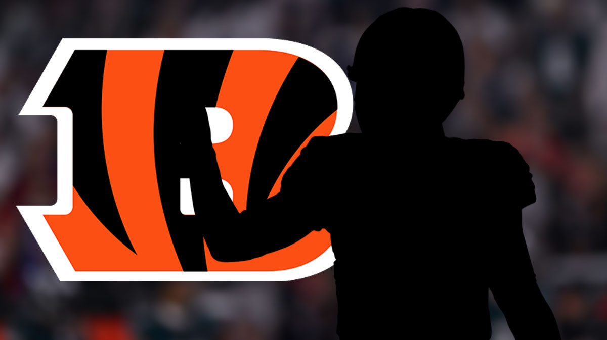 Dark silhouette of a football coach with a Bengals logo