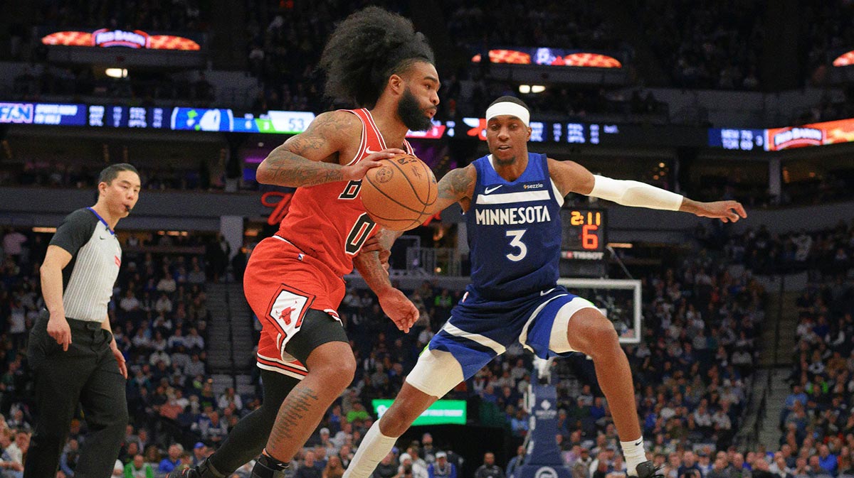 Chicago Bulls Guard Combi White (0) Drive to the basket like Minnesota Timbervolves Next Jaden McDaniels (3) in the second quarter at the target center. 