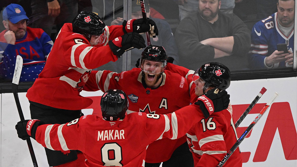 Feb 20, 2025; Boston, MA, USA; [Imagn Images direct customers only] Team Canada forward Connor McDavid (97) celebrates scoring in overtime to win with defenseman Devon Toews (5) and defenseman Cale Makar (8) and forward Mitch Marner (16) against Team USA during the 4 Nations Face-Off ice hockey championship game at TD Garden.