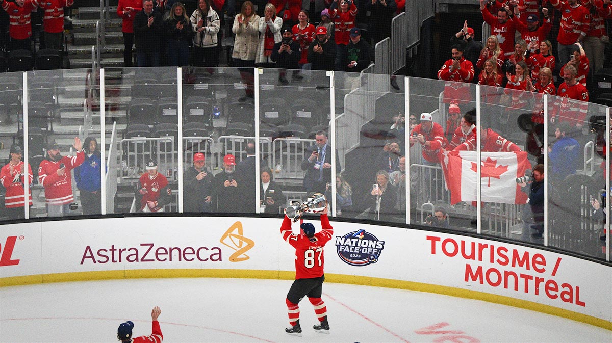 Team Canada forward Sidney Crosby (87) lifts the 4 Nations Face-Off trophy after winning against Team USA in overtime during the 4 Nations Face-Off ice hockey championship game at TD Garden. 