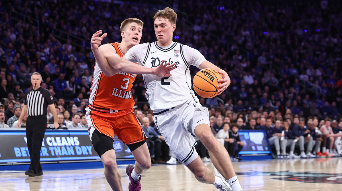 Duke Blue Devils guard Cooper Flagg (2) drives past Illinois Fighting Illini forward Ben Humrichous (3) in the first half at Madison Square Garden.