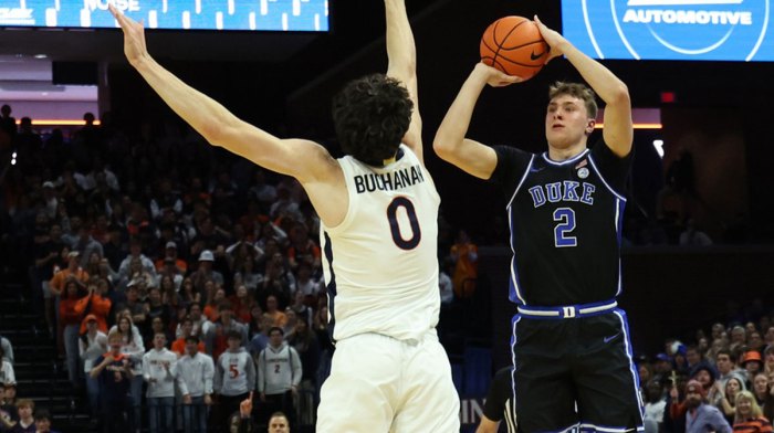 Duke Blue Devils guard Cooper Flagg (2) shoots the ball over Virginia Cavaliers forward Blake Buchanan (0) in the first half at John Paul Jones Arena.