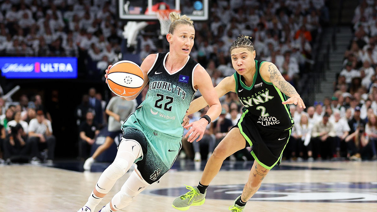 New York Liberty guard Courtney Vandersloot (22) drives past Minnesota Lynx guard Natisha Hiedeman (2) during the second half of game four of the 2024 WNBA Finals at Target Center. 