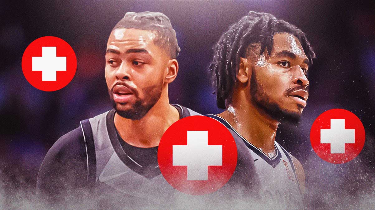 D'Angelo Russell and Cam Thomas with medical signs