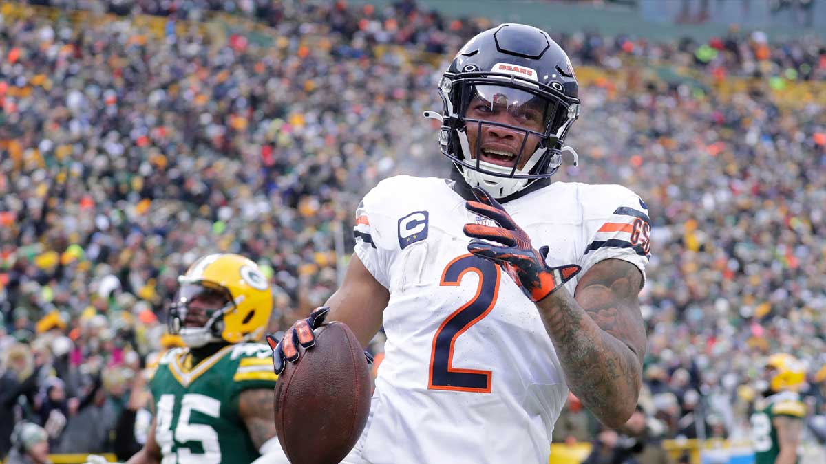 Chicago Bears wide receiver DJ Moore (2) scores a touchdown on a reception against the Green Bay Packers in the fourth quarter during their football game Sunday, January 5, 2025, at Lambeau Field in Green Bay, Wisconsin.