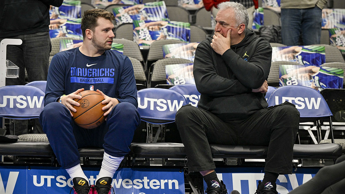 Dallas Mavericks Guard Luka Dončić (left) Talked with Father Sasha Doncić (right) before the game between Dallas Mavericks and Vishington Vizards in American Airlines Center.