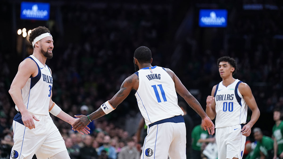 Dallas Mavericks Clai Thompson (31) and guard Kiri Irving (11) respond after playing against Boston Celtics in the second half in TD Garden.