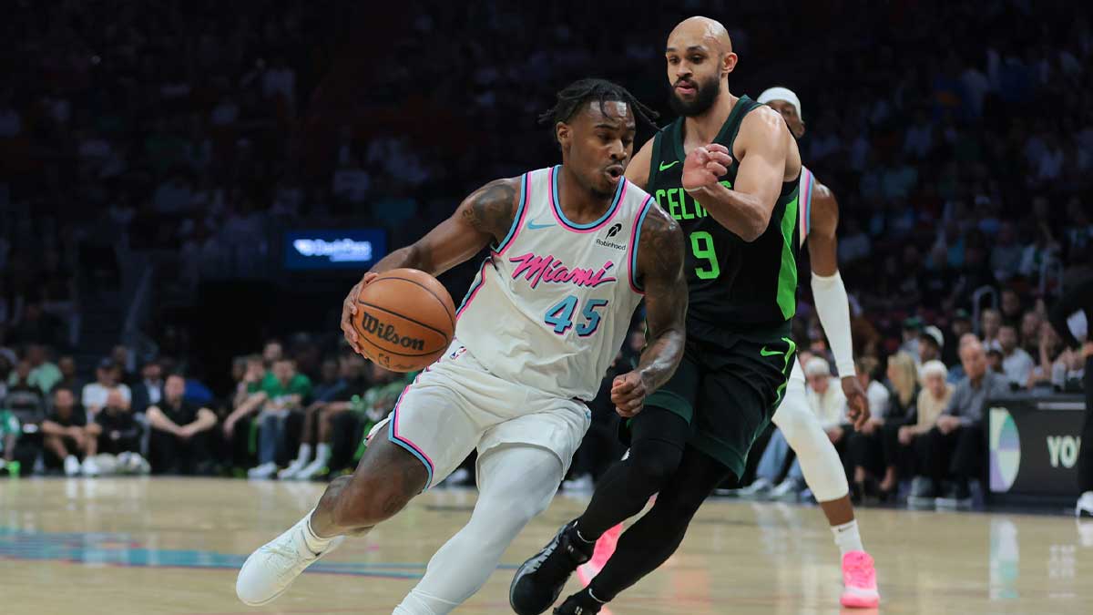 Miami Heat Garnid Davion Mitchell (45) Drive to Cart last Boston Celtics Guard Derrick White (9) during the first quarter in the center of Kaseya.