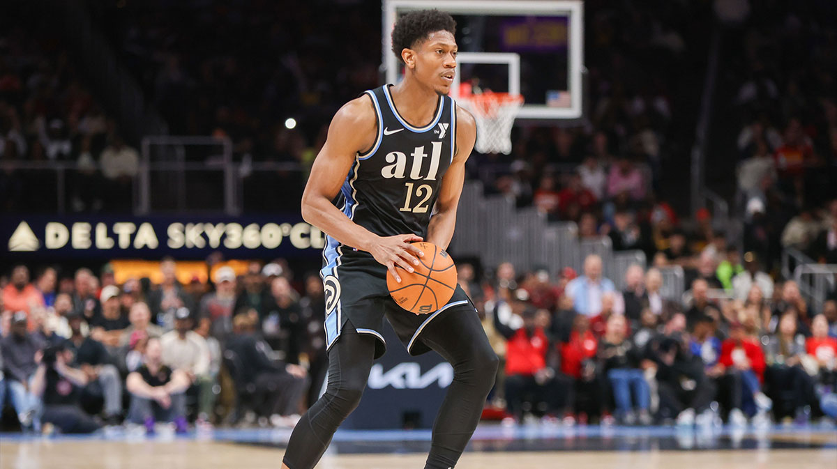 Atlanta Hawks Next De'andre Hunter (12) handles the ball against Cliveland Cavaliers in the second half at the State Farm Arena.