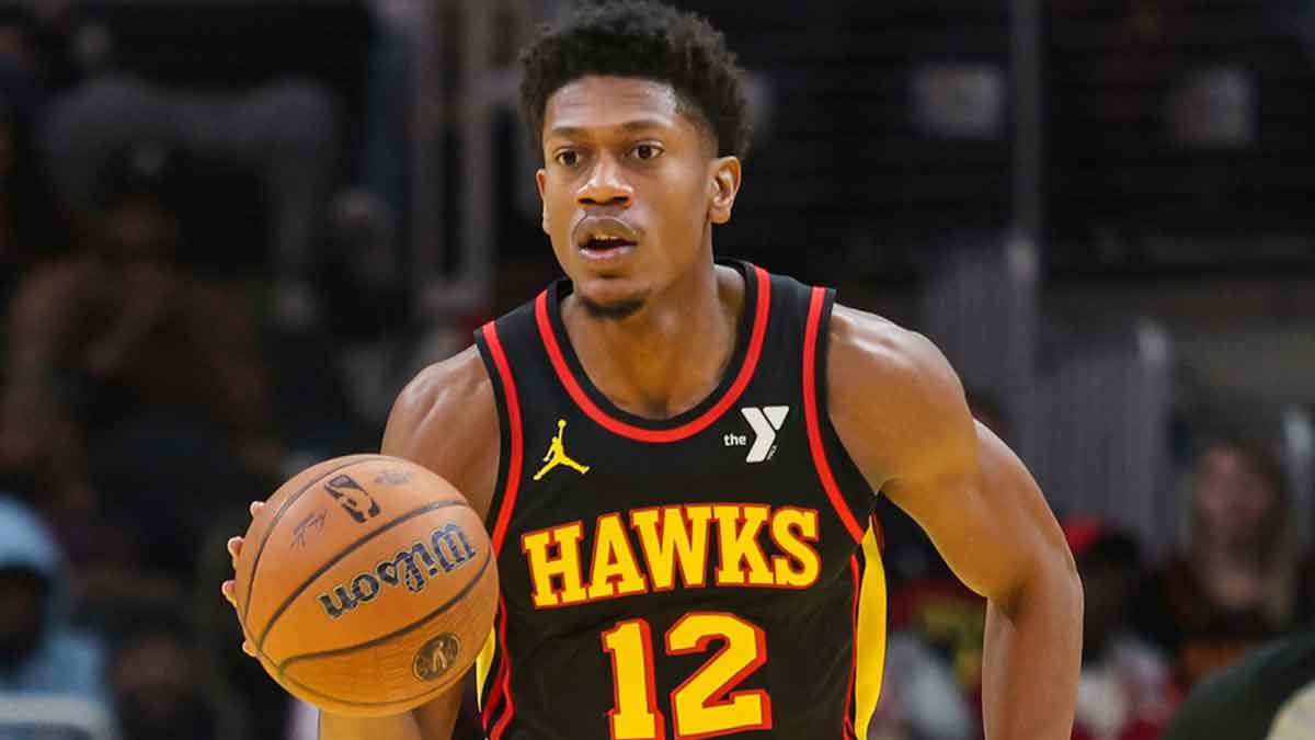 Atlanta Hawks Next De'andre Hunter (12) Dribblible Ball in court against Cleveland Cavaliers during the first quarter on the State Farm Arena.