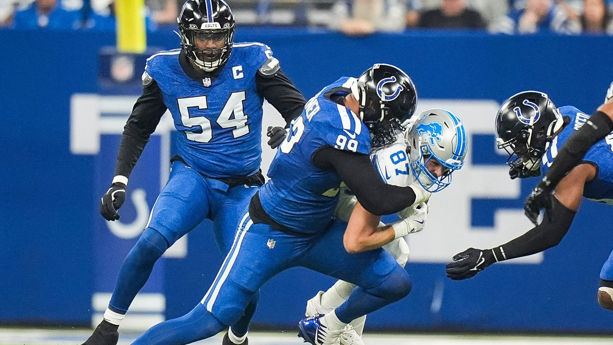 Detroit Lions tight end Sam LaPorta (87) is tackled by Indianapolis Colts defensive tackle DeForest Buckner (99) during the first half at Lucas Oil Stadium in Indianapolis, Ind. on Sunday, Nov. 24, 2024.
