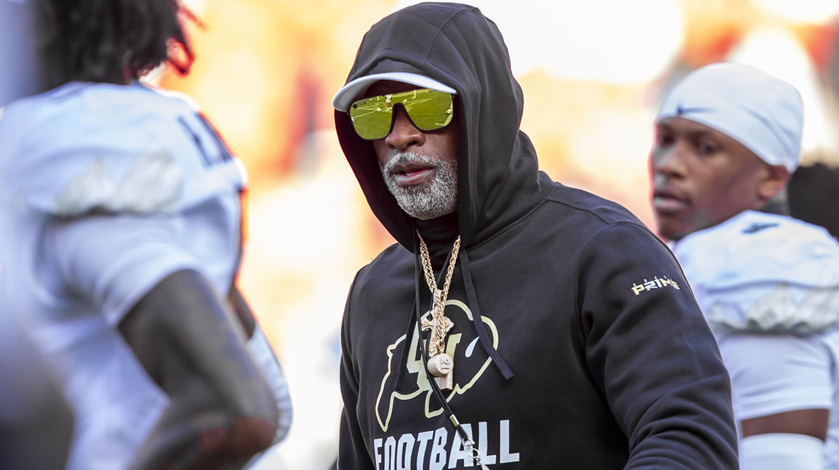 Nov 23, 2024; Kansas City, Missouri, USA; Colorado head coach Deion Sanders watches his players warmup prior to the game between the Kansas Jayhawks and the Colorado Buffaloes at GEHA Field at Arrowhead Stadium.