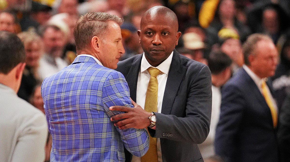 Alabama Crimson Tide head coach Nate Oats and Missouri Tigers head coach Dennis Gates embrace after the game at Mizzou Arena.