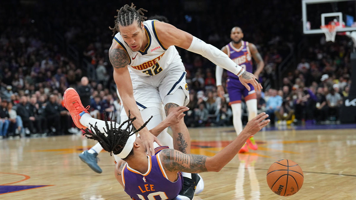 Denver Nuggets Next Aaron Gordon (32) And Phoenix Suns Guard Damion Lee (10) collides during the first half in the center of Footprint.