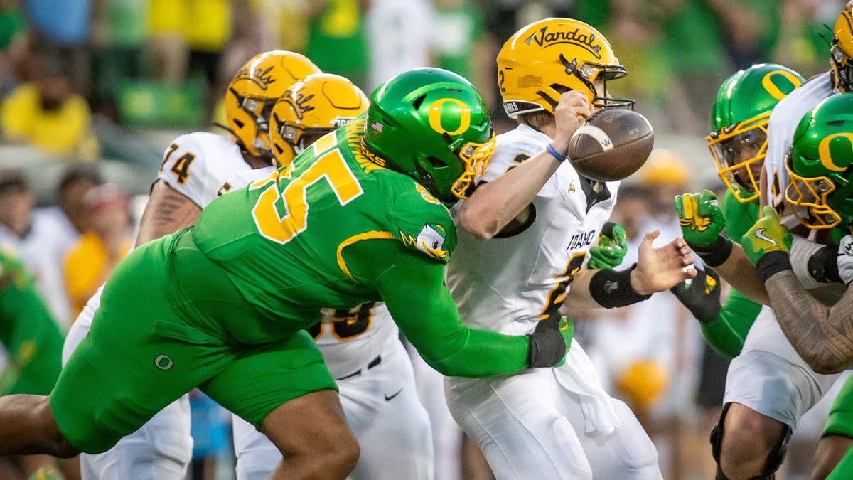 Oregon Ducks defensive lineman Derrick Harmon forces a fumble from Idaho Vandals quarterback Jack Layne as the Oregon Ducks host the Idaho Vandals Saturday, Aug. 31, 2024, at Autzen Stadium in Eugene, Ore.