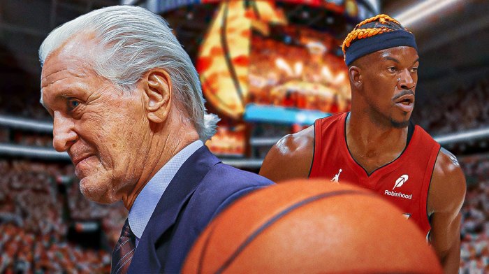 Heat president Pat Riley next to former Heat forward Jimmy Butler with a sealed letter in the background