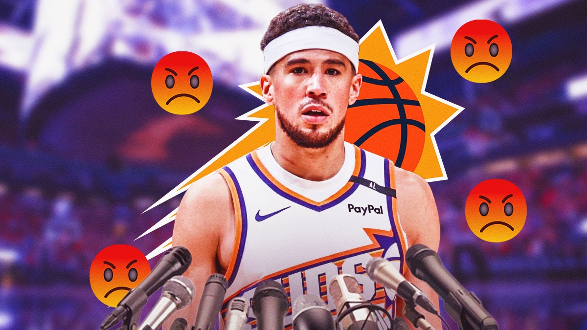 Devin Booker with microphones around him, and angry emojis around him, along with the Suns logo in the background.