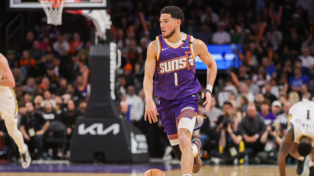 Phoenix Suns Guard Devin Booker (1) Dribbles v. New Pelican Orleans in the fourth quarter within Footprint Center.