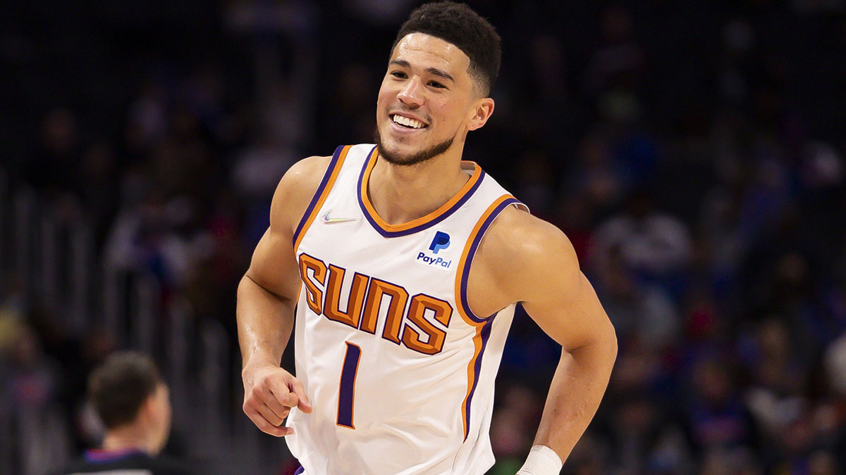 Phoenix Suns guard Devin Booker (1) smiles just after the second quarter against the Detroit Pistons at Little Caesars Arena.