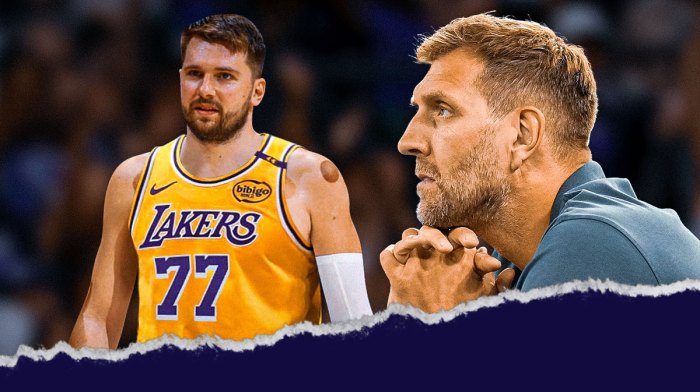 Dirk sitting in the sidelines looking at Luka Doncic wearing Lakers gear.