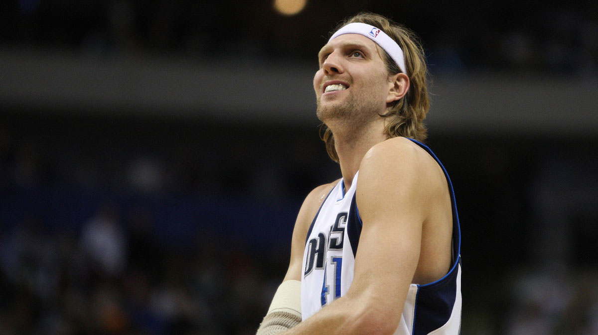 Dallas Mavericks striker Dirk Nowitzki (41) smiles during the match against the Detroit Pistons at the American Airlines Center.