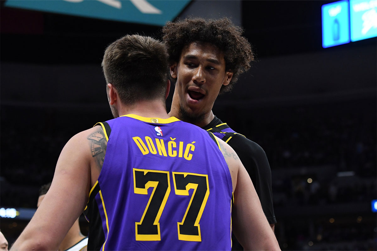 Los Angeles Lakers guard Luka Doncic (77) is congratulated by center Jaxson Hayes (11) after making a basket during the second half against the Denver Nuggets at Ball Arena