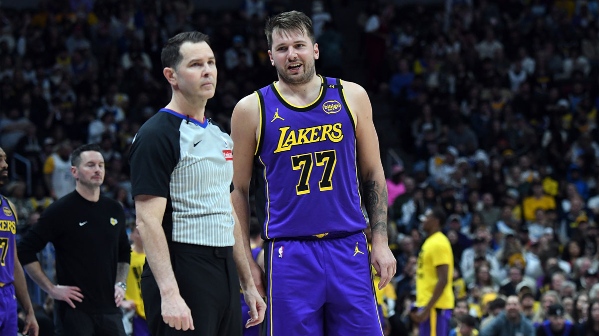 Los Angeles Lakers guard Luka Doncic (77) talks with an official during a stoppage in play in the first half at Ball Arena.