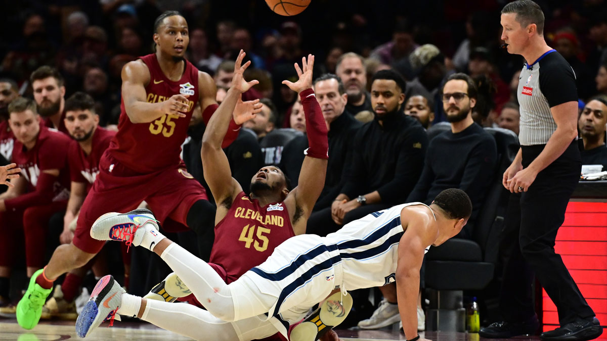 Cleveland Cavaliers guard Donovan Mitchell (45) goes for a loose ball as forward Isaac Okoro (35) looks on during the second half at Rocket Arena.