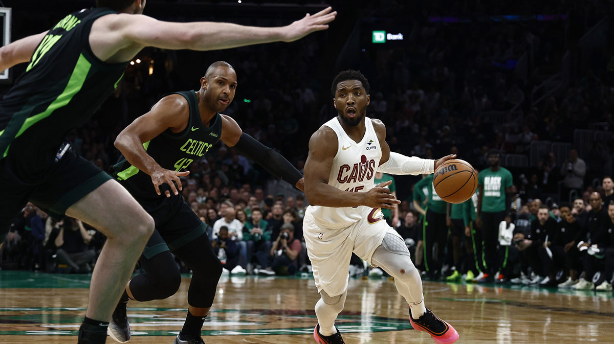 Cleveland Cavaliers guard Donovan Mitchell (45) drives past Boston Celtics center Al Horford (42) during the second half at TD Garden.