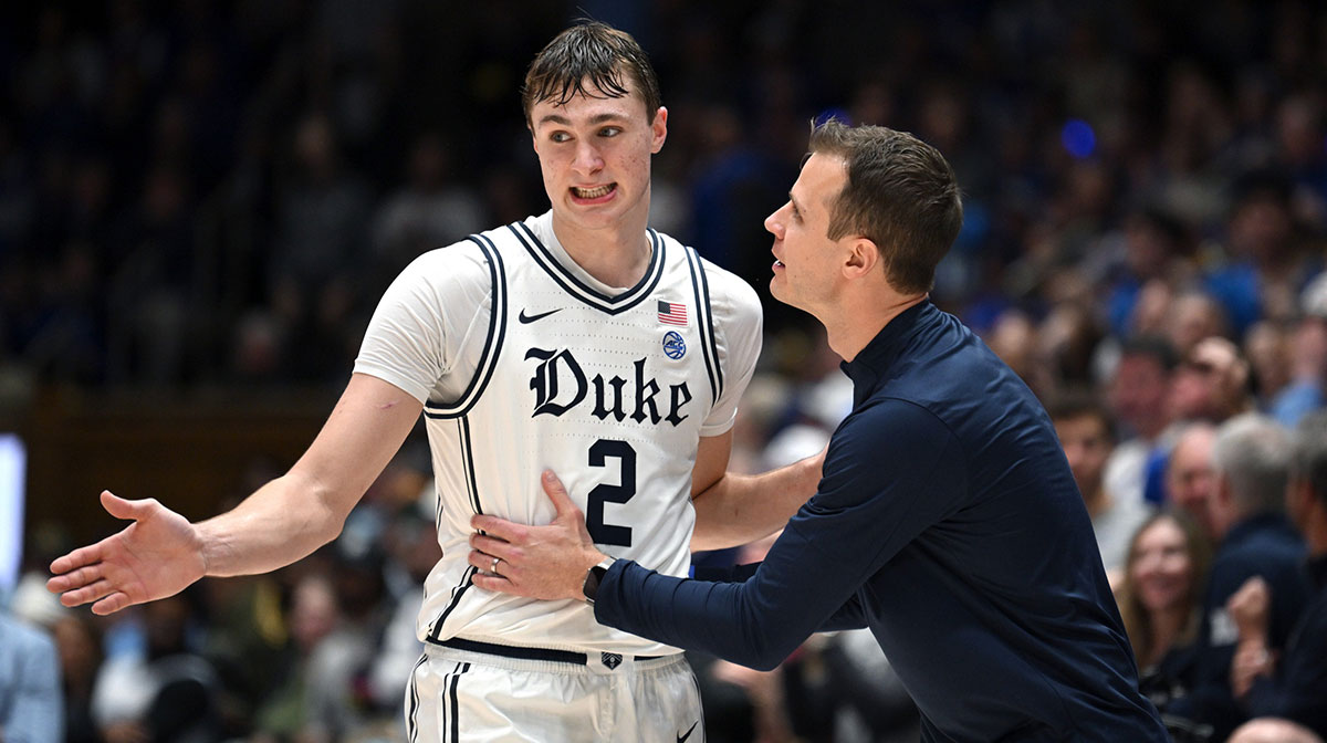 Duke Blue Devils head coach Jon Scheyer talks with forward Cooper Flagg (2) in the second half against the North Carolina Tar Heels at Cameron Indoor Stadium.