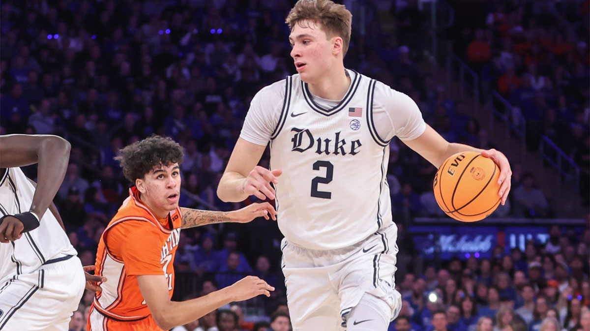 Duke Blue Devils guard Cooper Flagg (2) drives past Illinois Fighting Illini forward Will Riley (7) in the first half at Madison Square Garden