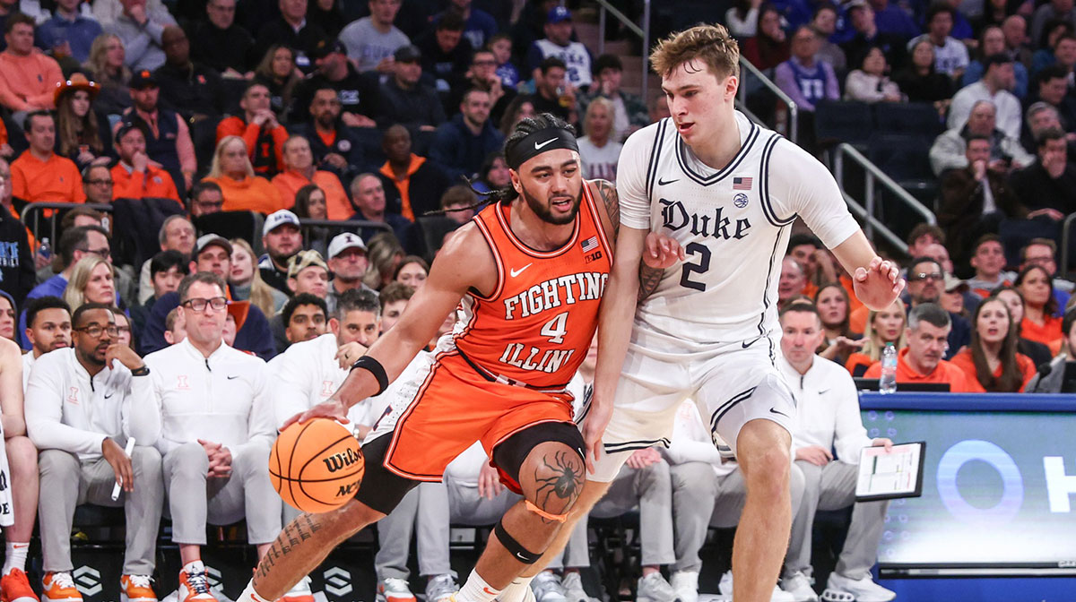 Illinois Fighting Illini guard Kylan Boswell (4) drives past Duke Blue Devils guard Cooper Flagg (2) in the second half at Madison Square Garden.