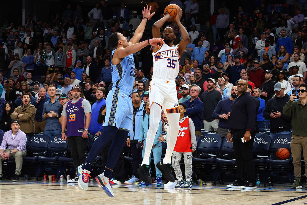 Phoenix Suns forward Kevin Durant (35) shoots as Memphis Grizzlies guard Desmond Bane (22) defends as time expires during the fourth quarter at FedExForum