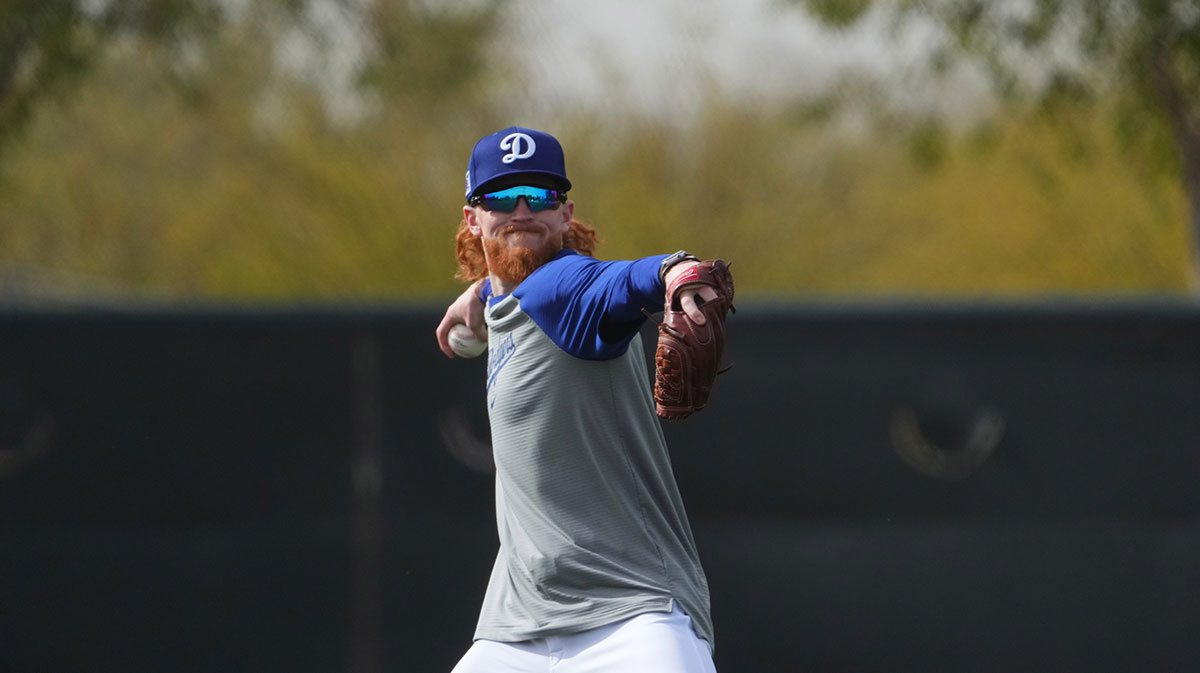 Los Angeles Dodgers pitcher Dustin May (85) throws during a Spring Training workout at Camelback Ranch.