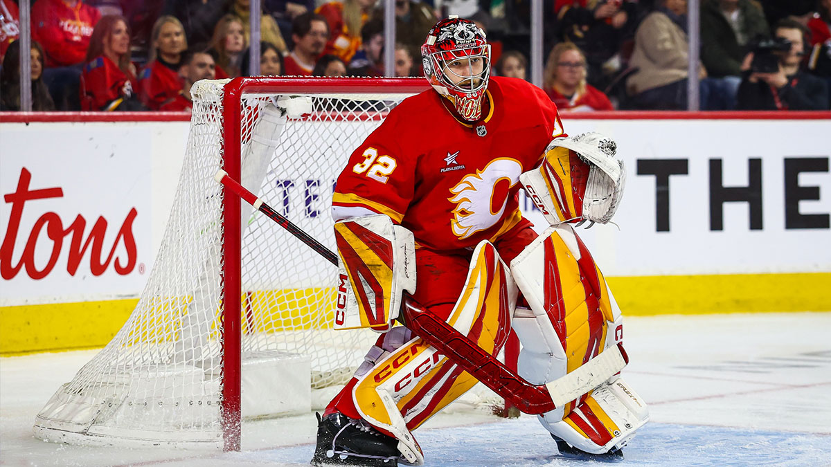 Calgary Flames goaltender Dustin Wolf (32) guards his net against the San Jose Sharks during the third period at Scotiabank Saddledome.