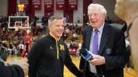 Michigan Wolverines head coach Dusty May talks to CBS broadcaster Bill Raftery after the game Indiana Hoosiers at Simon Skjodt Assembly Hall.