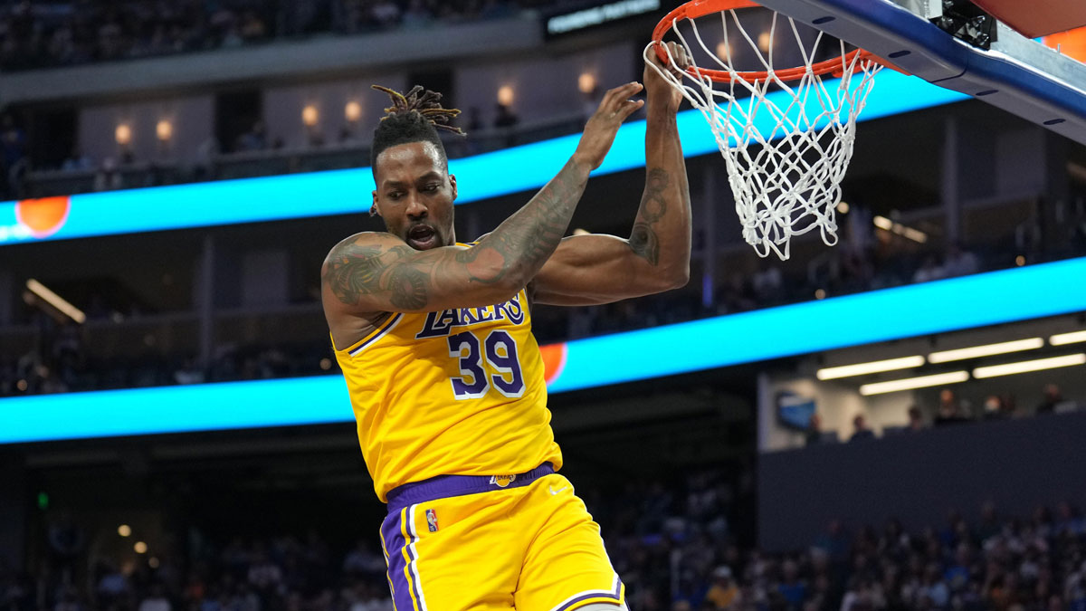 Los Angeles Lakers center Dwight Howard (39) hangs on the rim after a dunk during the second quarter against the Golden State Warriors at Chase Center.