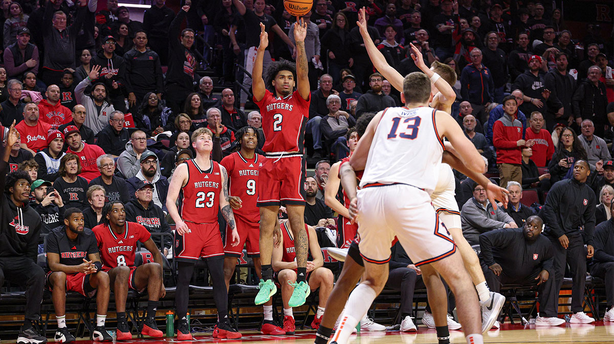 Rutgers Scarlet Knights guard Dylan Harper (2) makes a three point basket during the second half against the Illinois Fighting Illini at Jersey Mike's Arena.