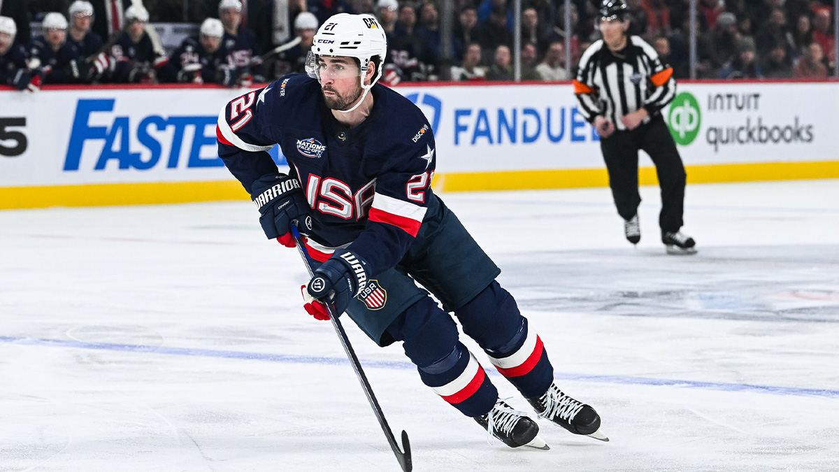 Feb 13, 2025; Montreal, Quebec, CAN; [Imagn Images direct customers only] Team USA forward Dylan Larkin (21) plays the puck against Team Finland in the first period during a 4 Nations Face-Off ice hockey game at Bell Centre.