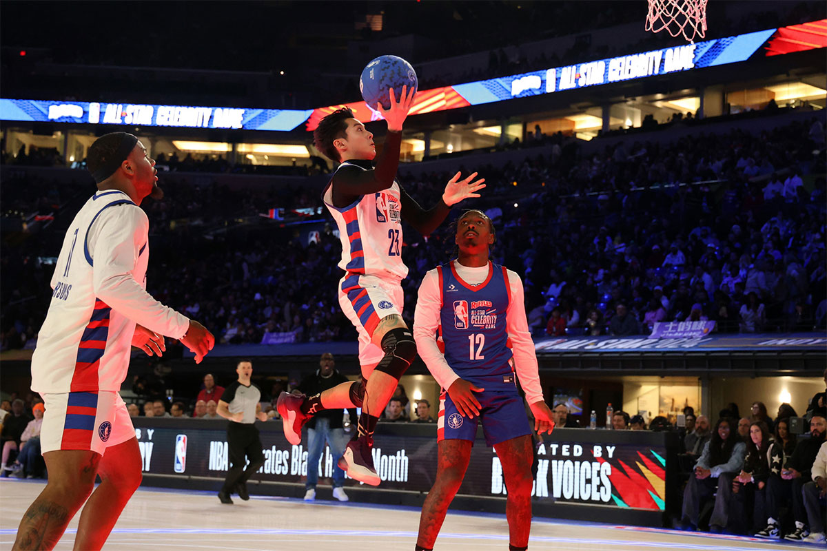 Dylan Wang (23) of Team Shannon shoots against Mecole Hardman Jr. (12) of Team Stephen A in the second half during the All Star Celebrity Game at Lucas Oil Stadium. 