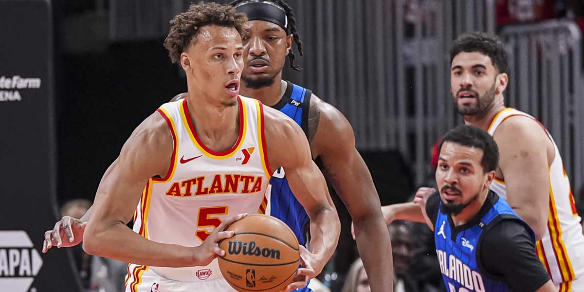 Atlanta Hawks guard Dyson Daniels (5) passes the ball against the Orlando Magic during the first half at State Farm Arena. 