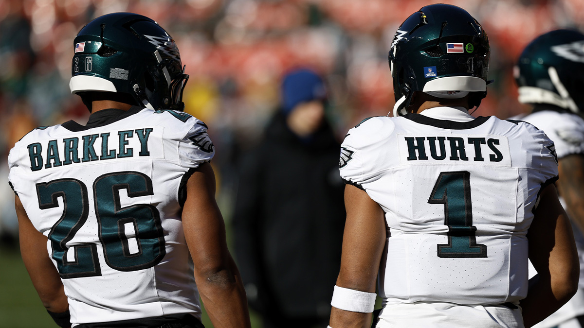 Philadelphia Eagles running back Saquon Barkley (26) and Eagles quarterback Jalen Hurts (1) stand on the field during warmup prior to the game against the Washington Commanders at Northwest Stadium.