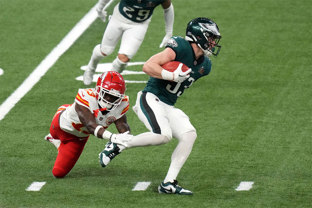 Philadelphia Eagles cornerback Cooper DeJean (33) returns a punt against Kansas City Chiefs safety Nazeeh Johnson (13) during the second quarter in Super Bowl LIX at Caesars Superdome.