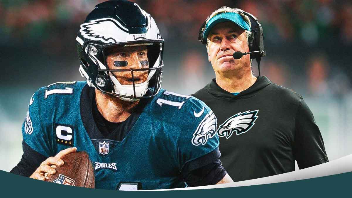 Carson Wentz next to Doug Pederson in front of the Eagles stadium.